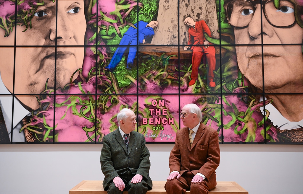 Gilbert Prousch (Left) and British artist George Passmore pose in front of an artwork entitled 'On the bench' 2019.