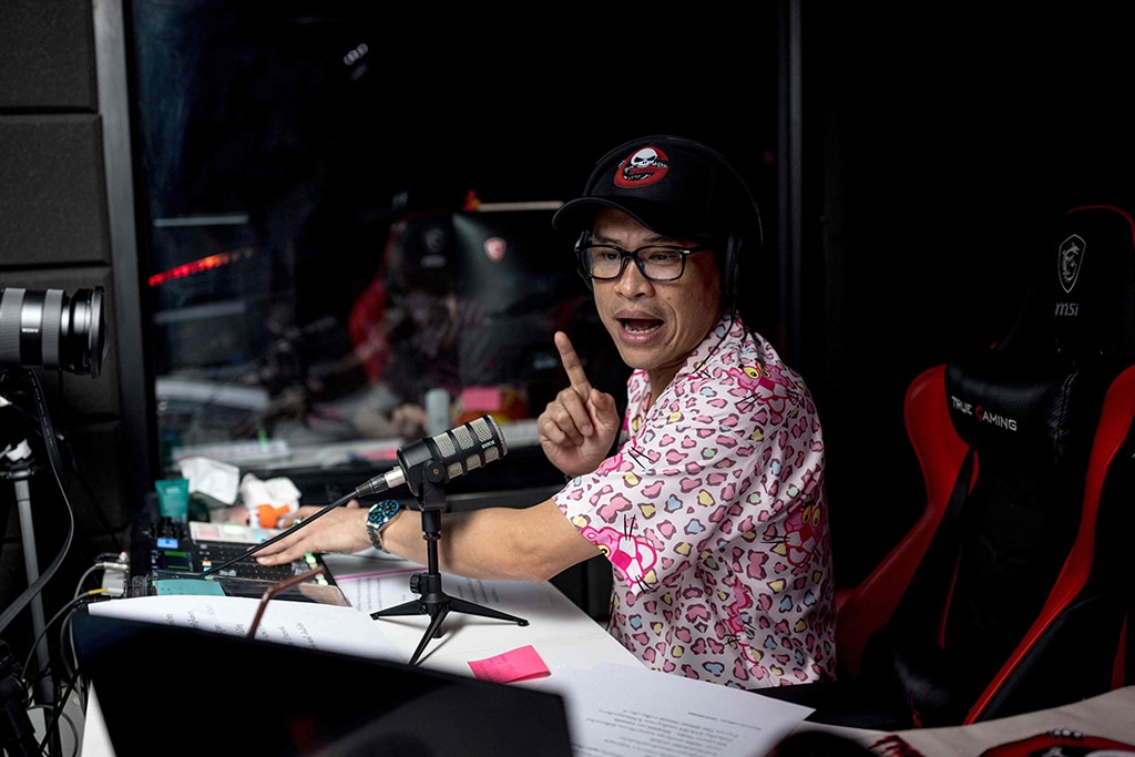 In this photo Ghost Radio station host Jack Watcharaphon broadcasts live from his studio in Bangkok
