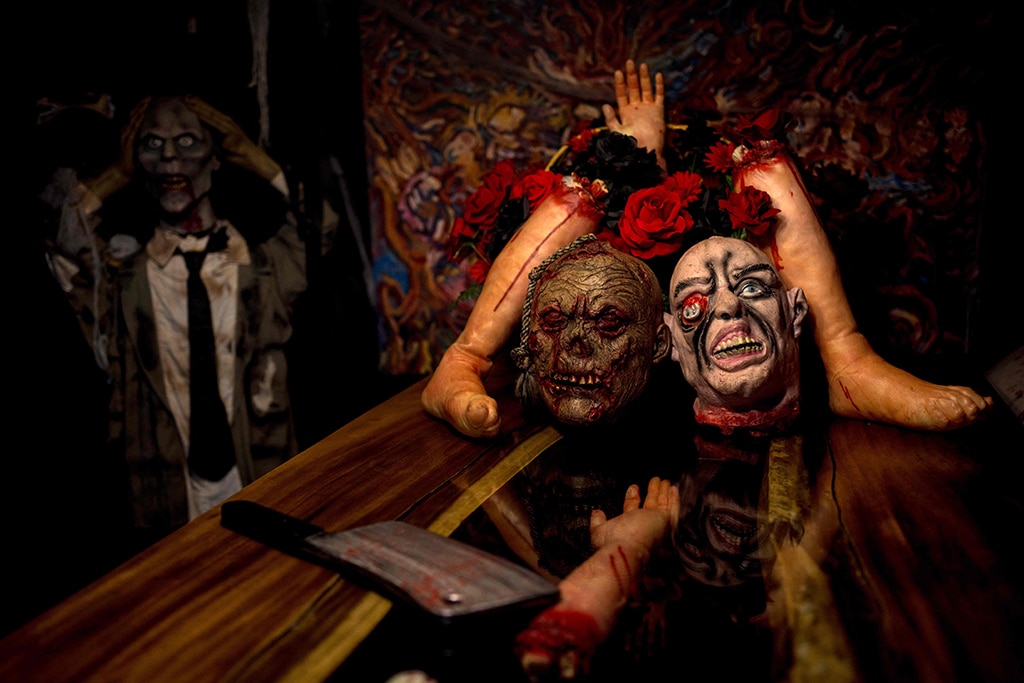 In this photo decorations of decapitated heads and bloody limbs are displayed at the Ghost House cafe.