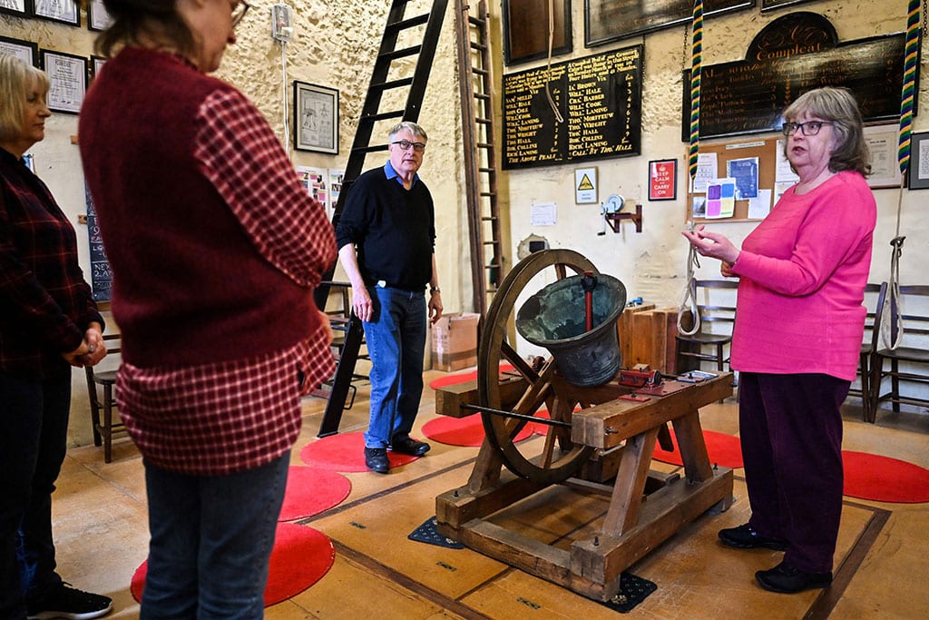 Tower Captain Paul Flavell (second right) and Kate Flavell (right) teach Charlotte Mafi and Anne Porter during a bell ringing training session at All Saints Church, in Kingston-upon-Thames, in southwest London.