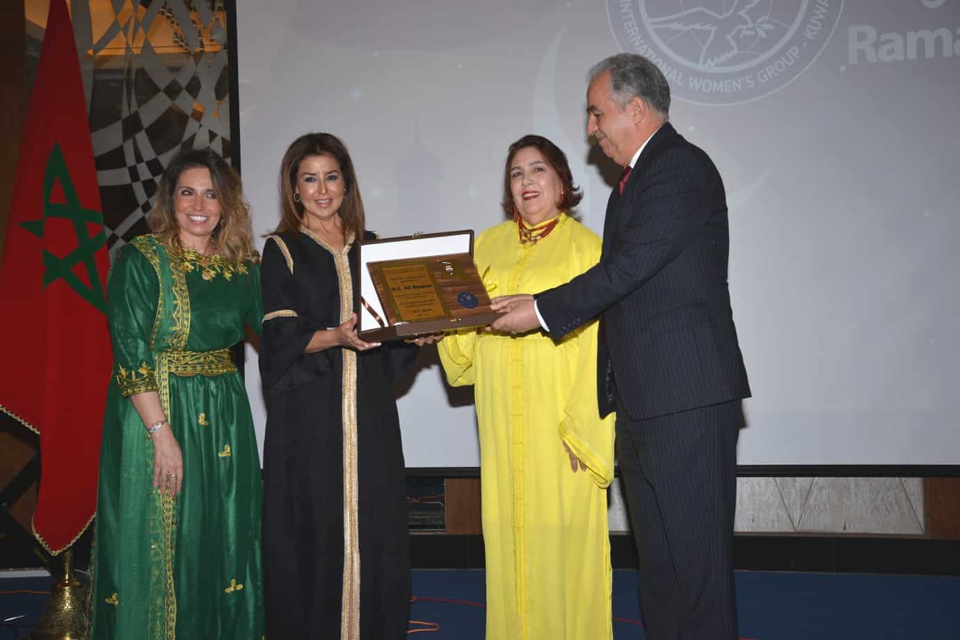 KUWAIT: (From left) President of IWG Ghada Shawky and Honorary President of the IWG Sheikha Hanouf Bader Mohammed Al-Sabah presents the Moroccan ambassador’s spouse Aicha Al-Fasi and Ambassa- dor of the Kingdom of Morocco Ali Benaissa with a souvenir at the event.