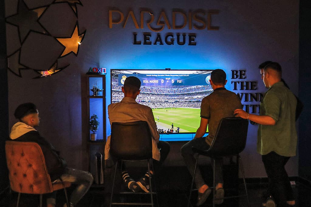 In this picture youths play an electronic football game at a video gaming centre in Libya's capital Tripoli.