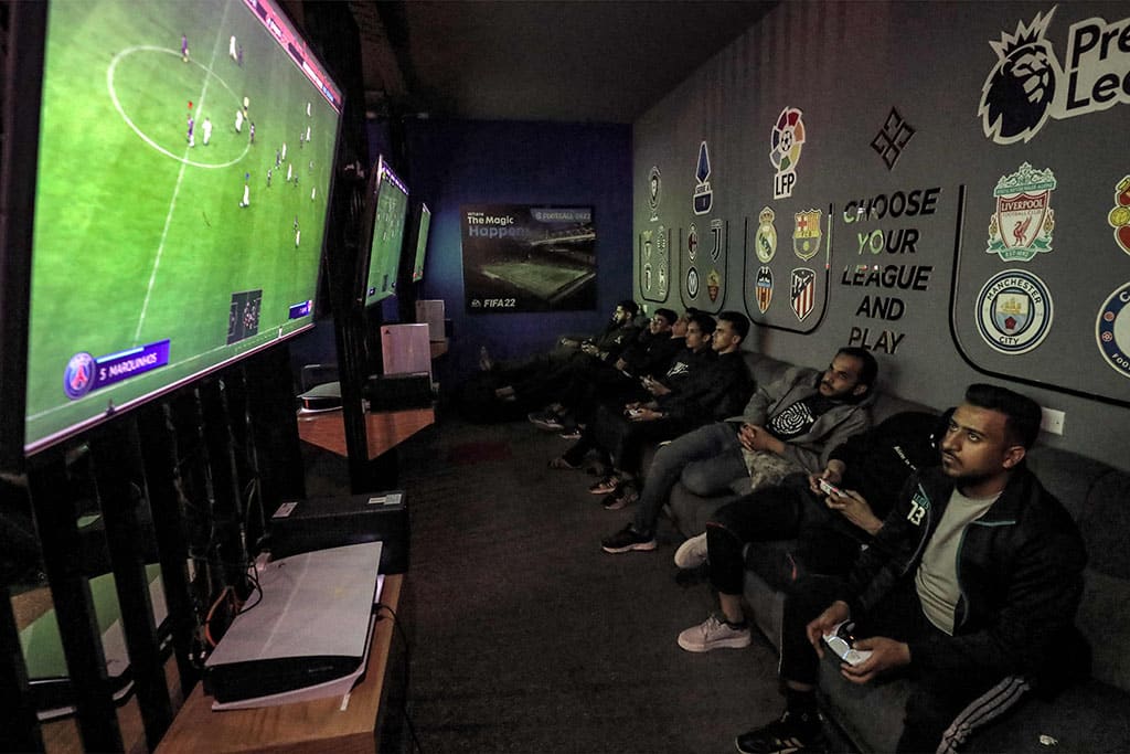In this picture youths play an electronic football game at a video gaming centre in Libya's capital Tripoli.