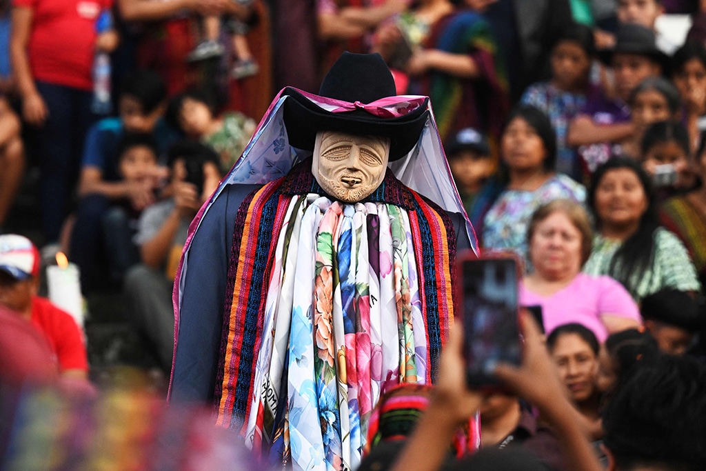 Mayan Tzutujil indigenous people take part in the (Rilaj Mam) (The great grandfather) during a Holy Burial procession.