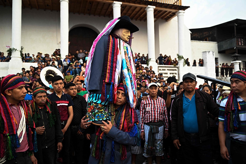 Mayan Tzutujil indigenous people take part in the (Rilaj Mam) (The great grandfather) during a Holy Burial procession.
