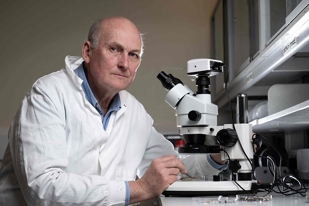 Director of the Marine Institute of Plymouth Professor Richard Thompson poses next to a microscope as he analyses nurdles and other micro-plastics in a laboratory.