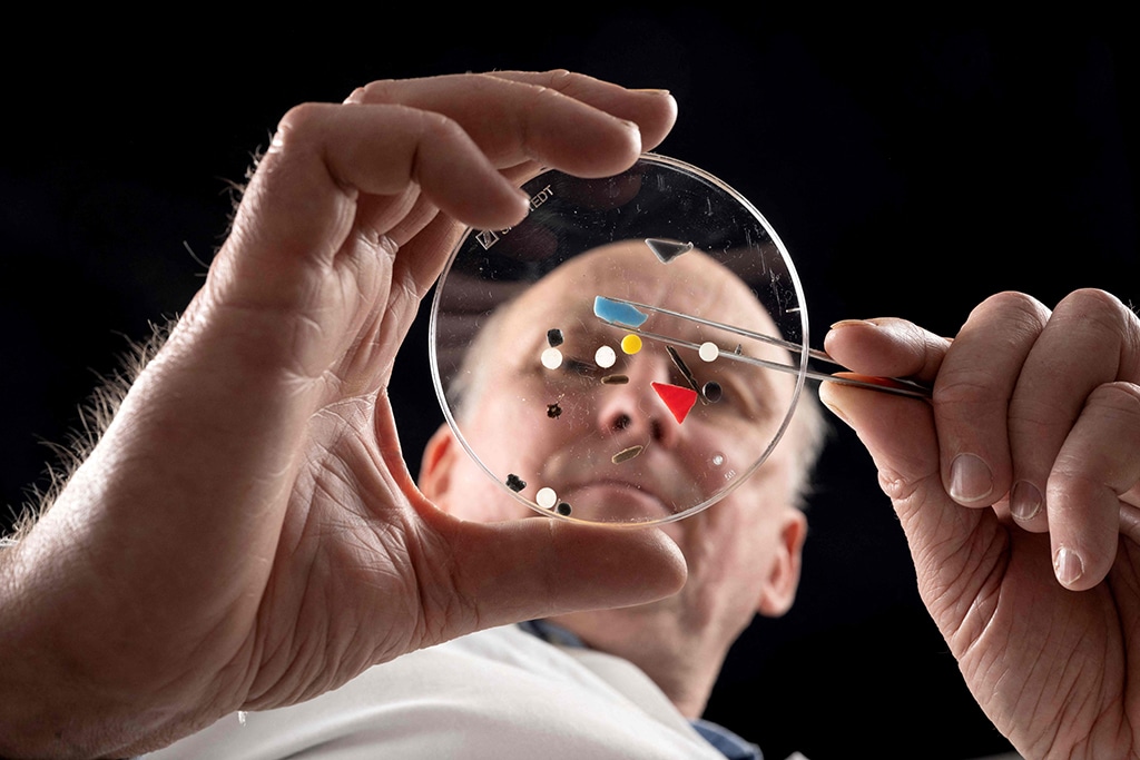 Director of the Marine Institute of Plymouth Professor Richard Thompson analyses nurdles and other micro-plastics in a laboratory.