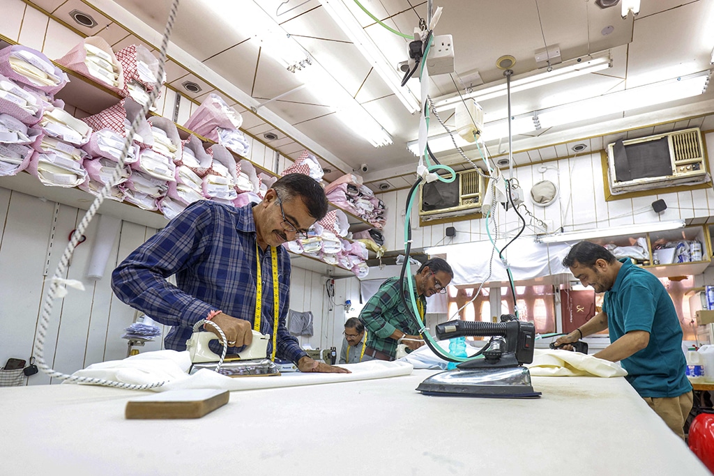 KUWAIT: Tailors make dishdashas at a shop in Kuwait City amidst high demand for Ramadan and Eid.