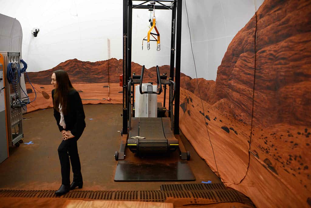 Dr Grace Douglas, CHAPEA principal investigator, walks through a simulated Mars exterior portion of the CHAPEA’s Mars Dune Alpha.