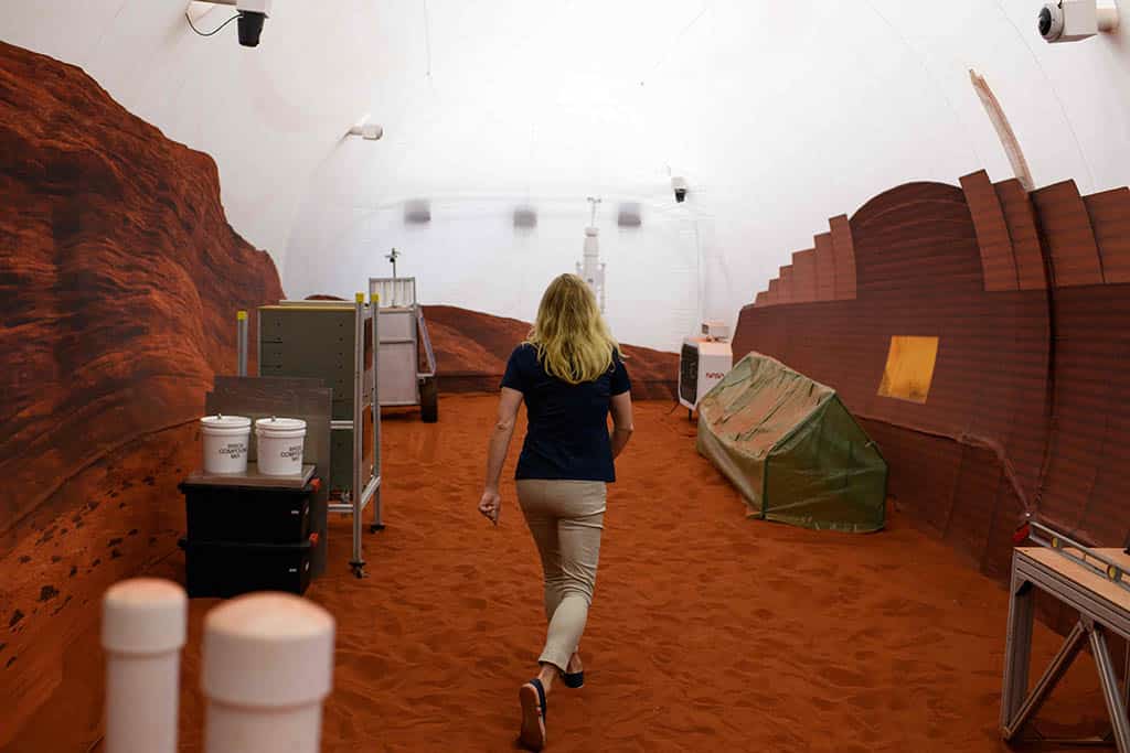 Dr Suzanne Bell, Lead for NASA’s Behavioural Health and Performance Laboratory, walks through a simulated Mars exterior portion of the CHAPEA’s Mars Dune Alpha.