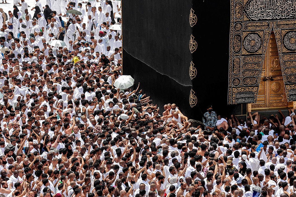 Muslim worshippers pray around the Kaaba, Islam's holiest shrine, at the Grand Mosque in the holy city of Mecca during the fourth Friday Noon prayers in the holy month of Ramadan.
