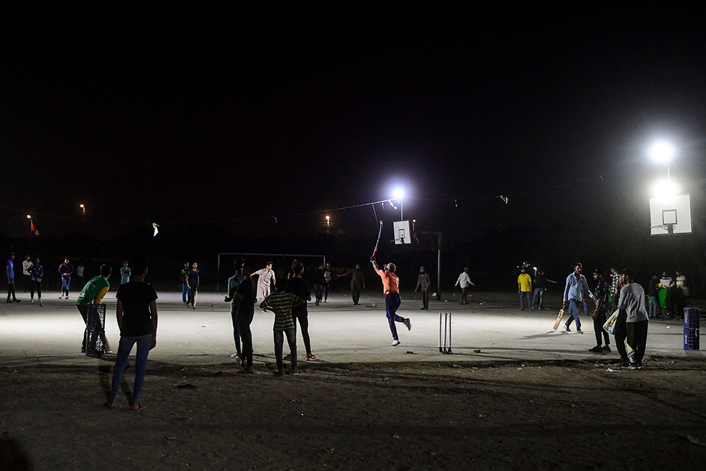 Youngsters play during the tape ball night cricket tournament during the Muslim holy fasting month of Ramadan in Karachi.