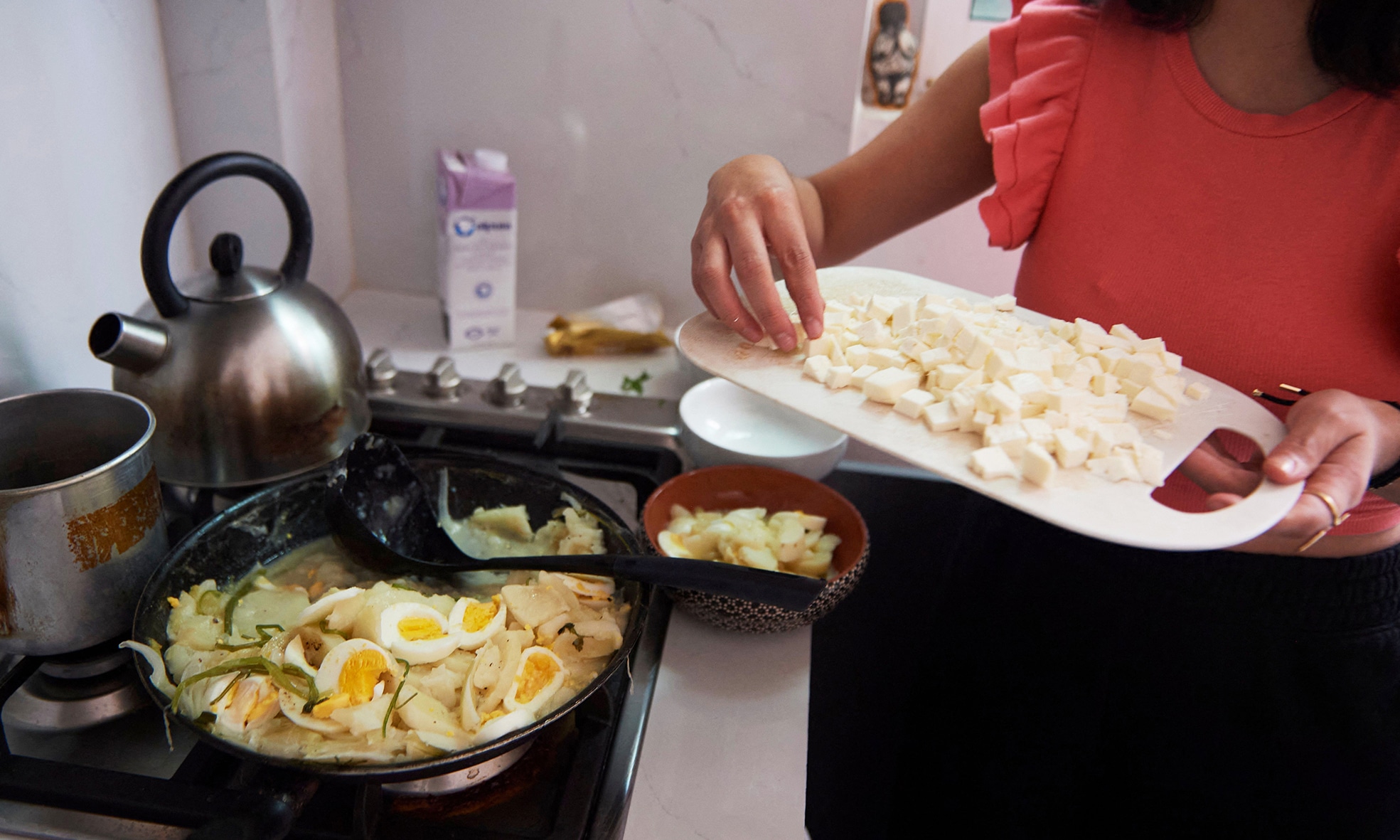 Venezuelan migrant Laura Linares prepares turmada, a Venezuelan Andean dish, at her house in Mexico City.