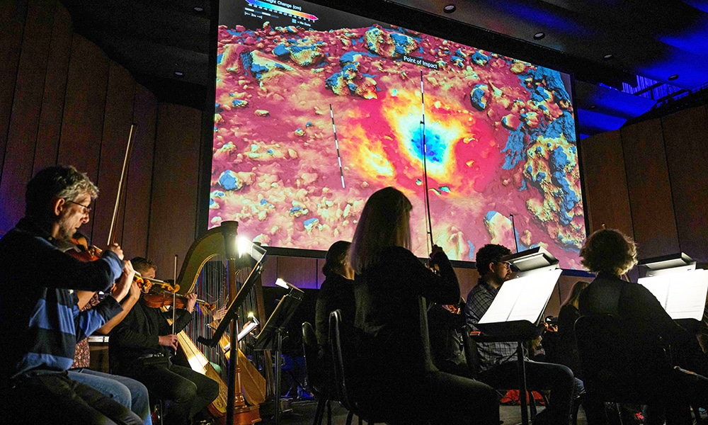Members of the National Philharmonic rehearse  'Cosmic Cycles, A Space Symphony' by composer Henry Dehlinger, at Capital One Hall in Arlington, Virginia.