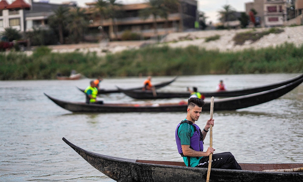 People row traditional 'meshhouf' boats in the Tigris river in Baghdad.