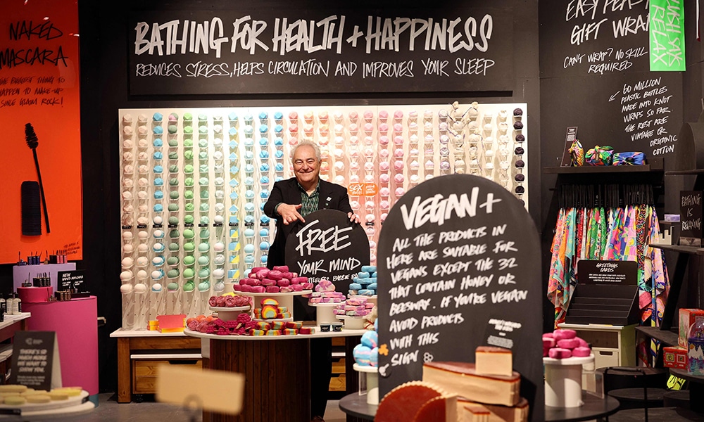 Mark Constantine, co-founder and co-CEO of Lush, poses for a photograph inside a 'mock up' of a store at the cosmetic company's headquarters in Poole, England.