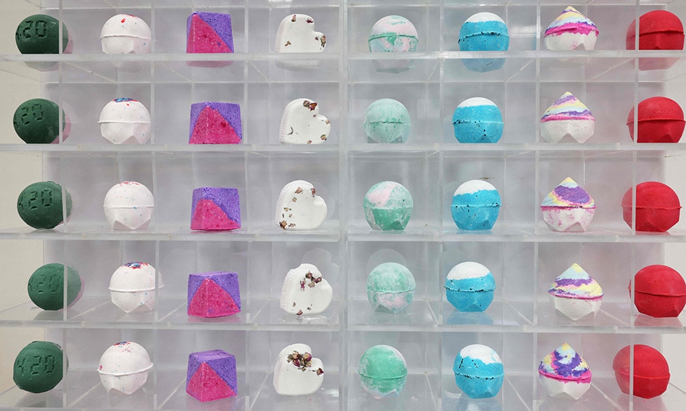Bath bombs are displayed in cases in the 'Ballistics Department' at Lush cosmetic company in Poole, England.