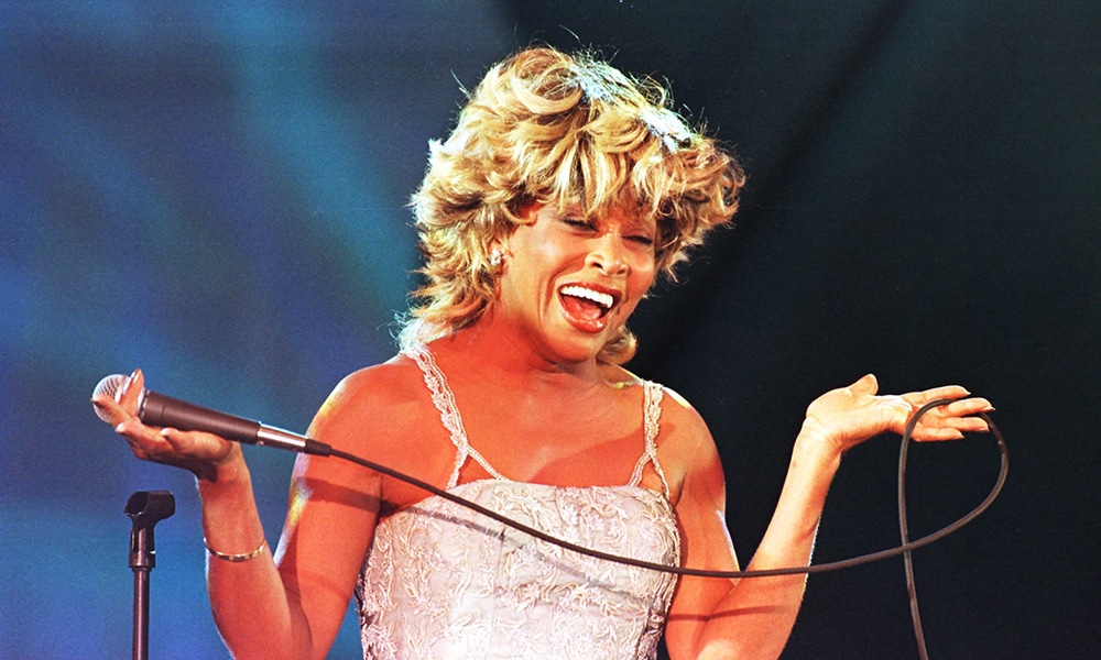 US singer Tina Turner sings during her performance at the Macy's Passport '97 fund raiser and fashion show 18 September in San Francisco, CA.