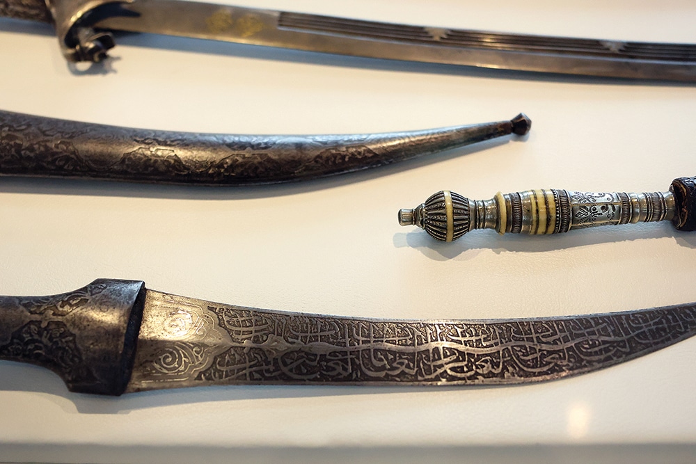 A collection of daggers of different sizes with Islamic inscriptions of them, dating back to the Persian, Ghajar and Mughal eras displayed at Kuwait national museum in Kuwait City on May 18, 2023, during an exhibition on the occasion of the International Museums day.