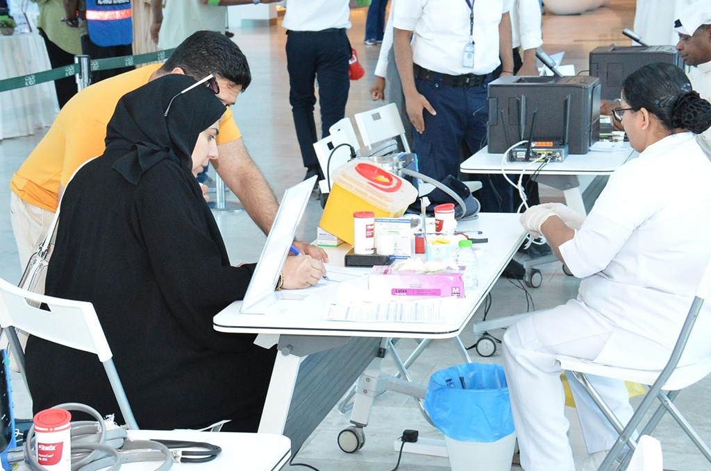 A donor registers her information before donating blood.