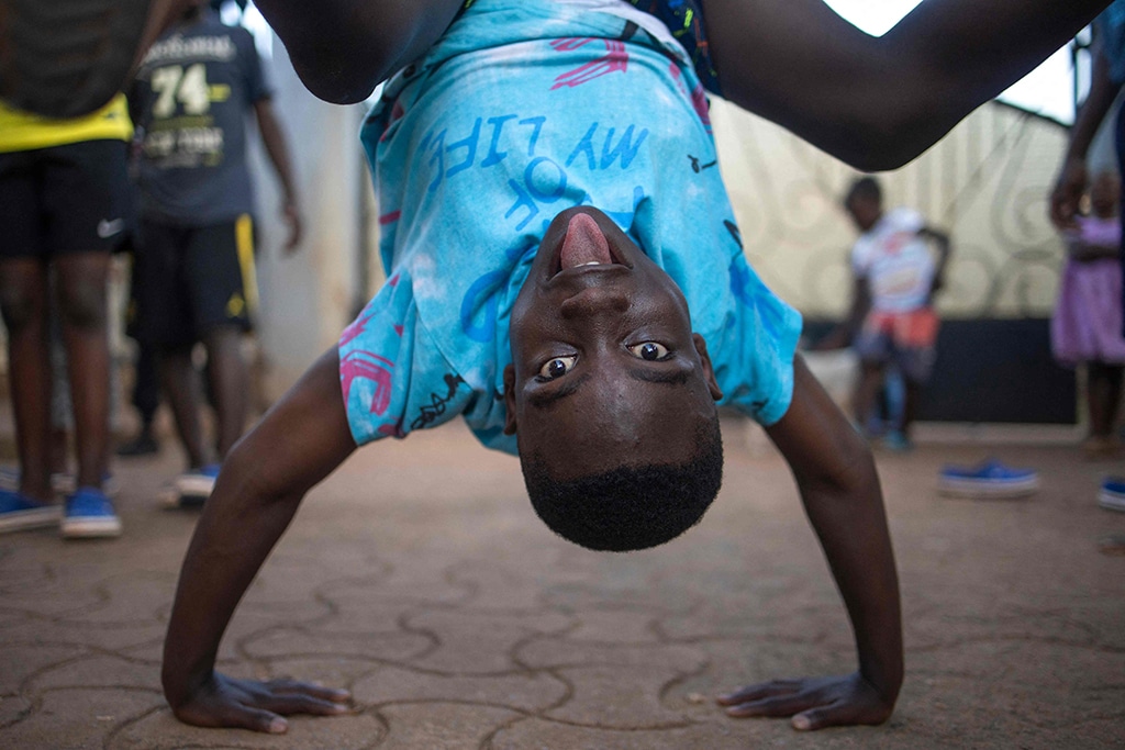 Benjamin Kayanja, 11, a member of the Ugandan dance group 'the Ghetto Kids' dances during a rehearsal at their home.