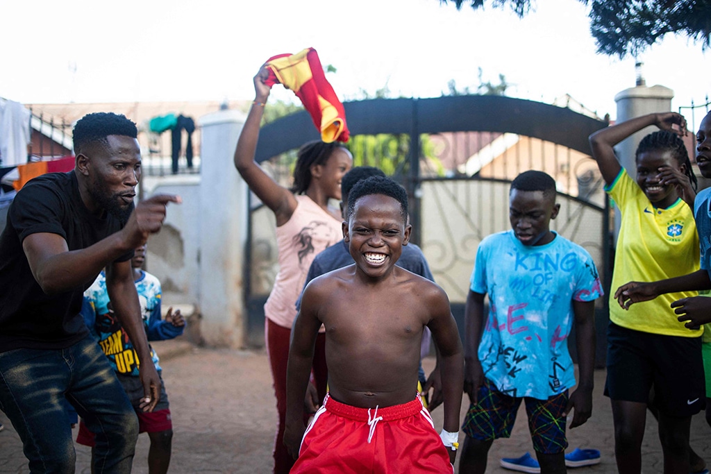 Akram Muyanja (center), 13, a member of the Ugandan dance group 'the Ghetto Kids' dances during a rehearsal at their home in Kampala.