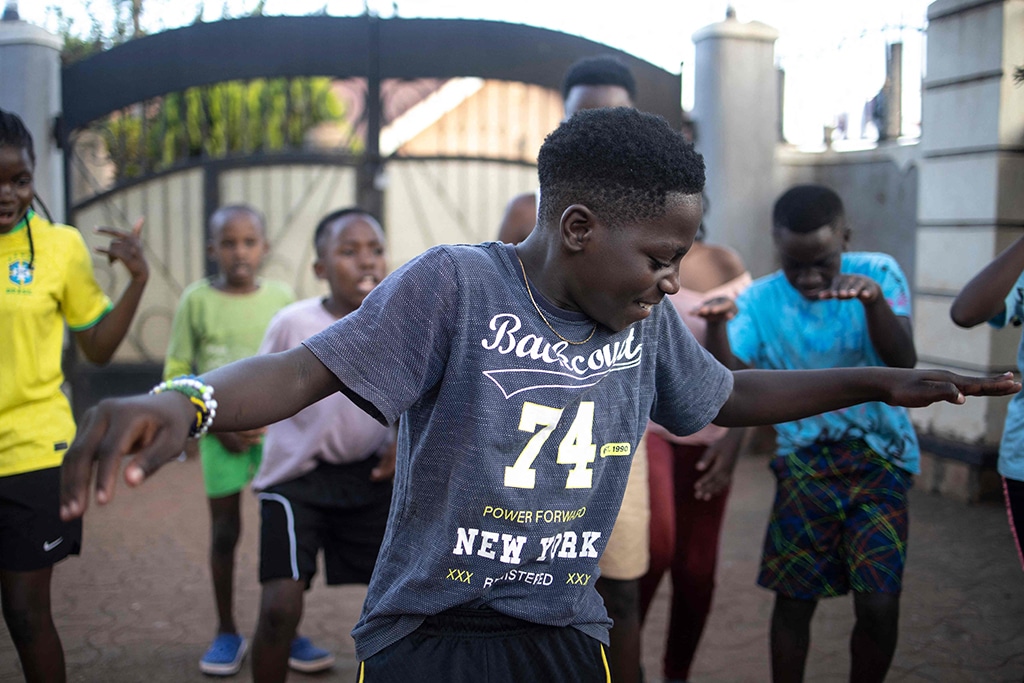 Ashiraf Mbaziira, 11, of the Ugandan dance group 'the Ghetto Kids' dances during a rehearsal at their home.