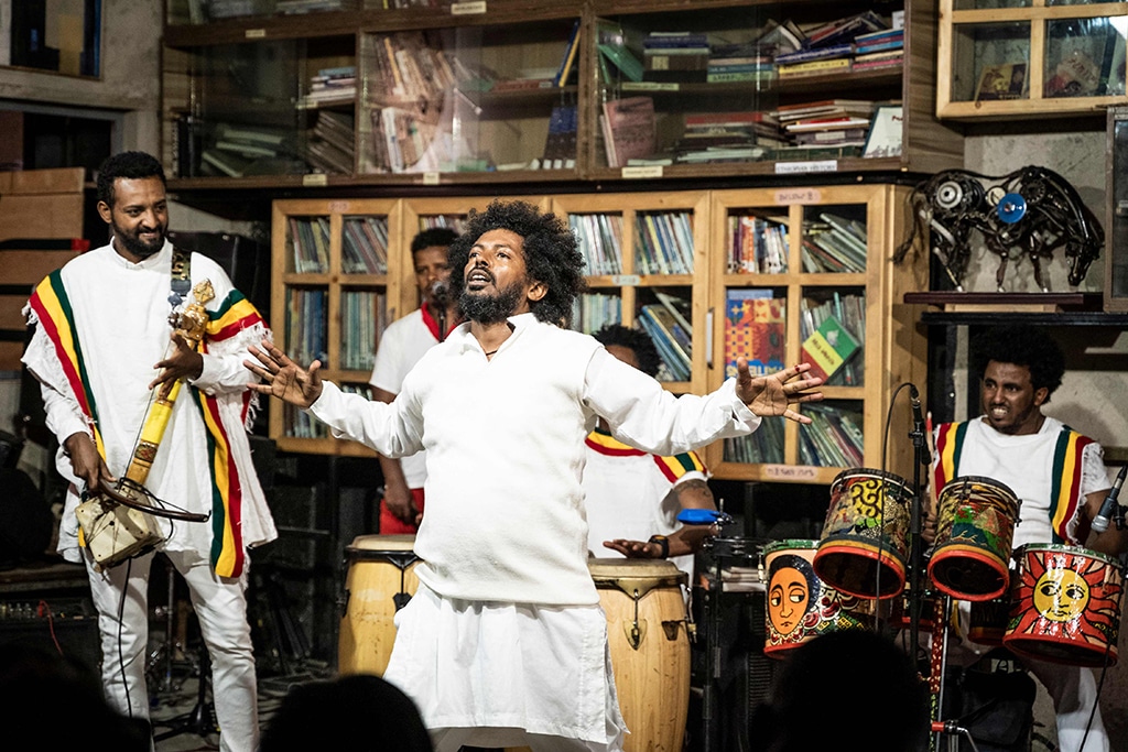 Melaku Belay (center), director of Fendika Cultural Center and founder of Ethiocolor dance group, gestures as he performs traditional dances in Addis Ababa.