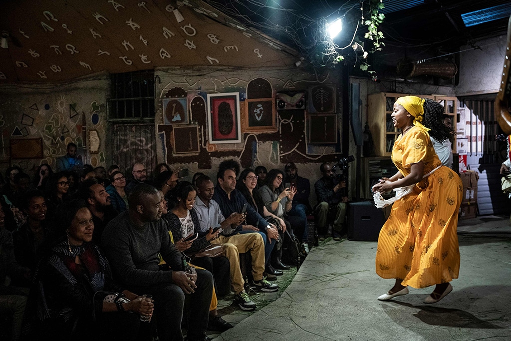 A member of Ethiocolor dance group performs a traditional dance at Fendika Cultural Center.
