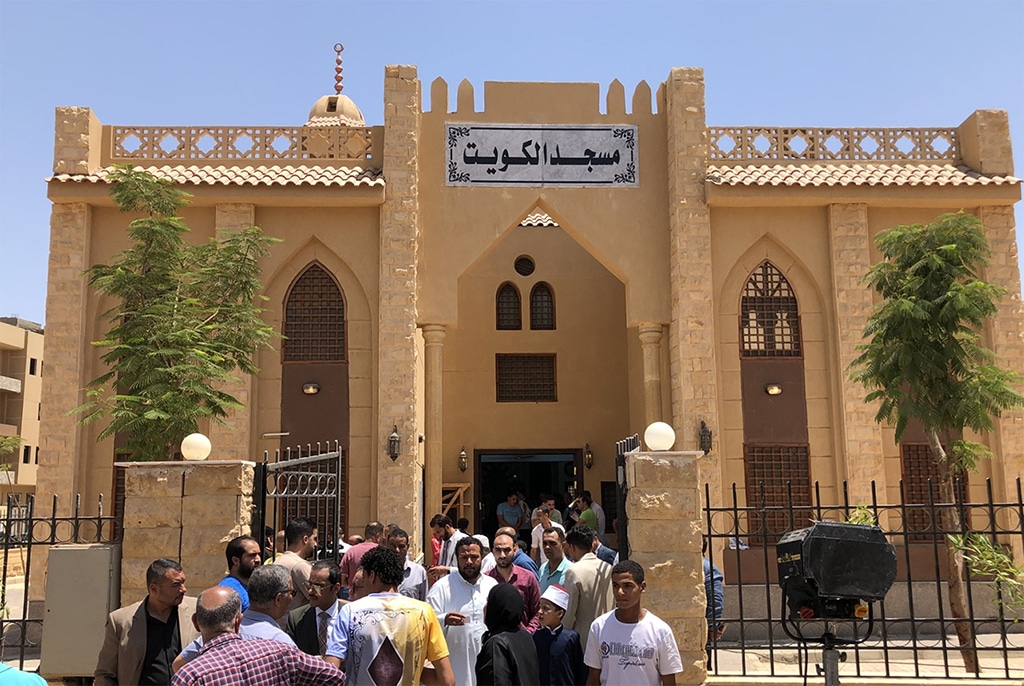 Worshippers exit the Kuwait Mosque after Friday prayers on July 28, 2023.