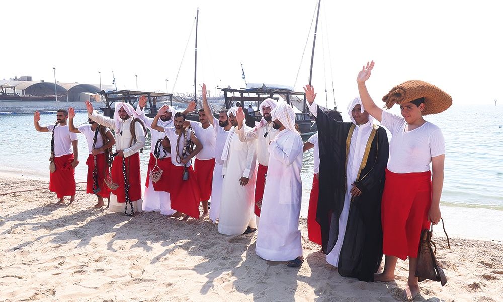 The Kuwaiti young divers waving goodbye to their parents