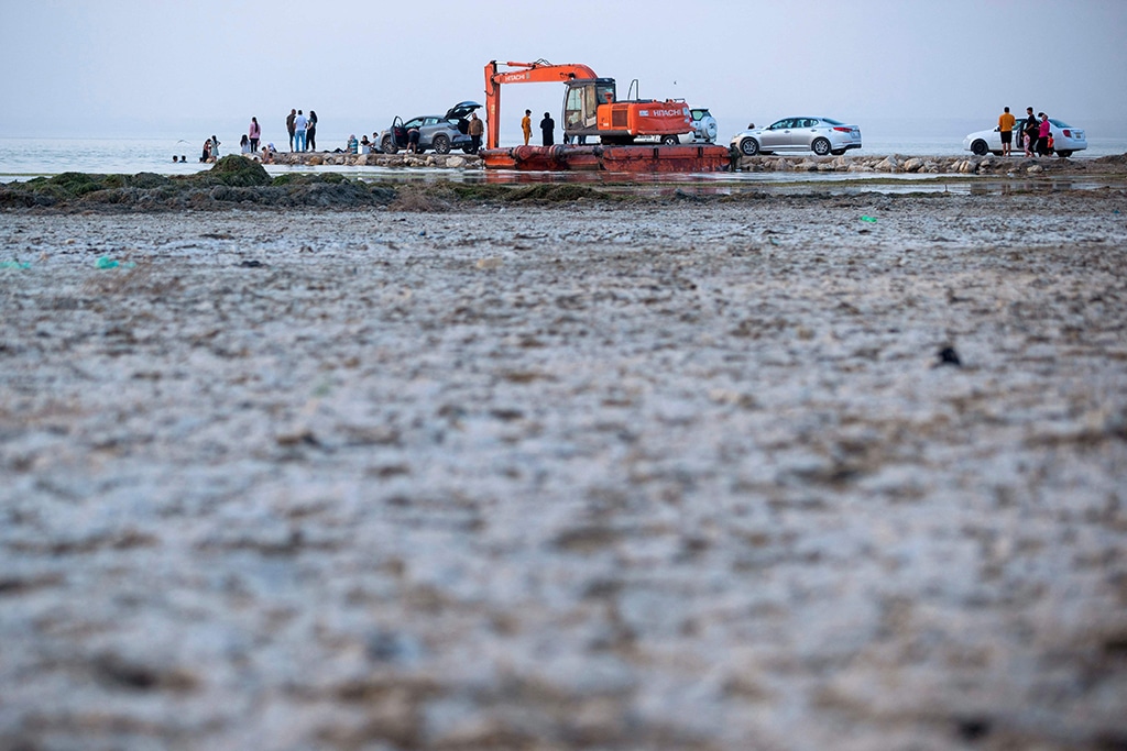 People swim in the receding waters of the Habbaniyah lake affected by severe drought in Iraq's Anbar province.